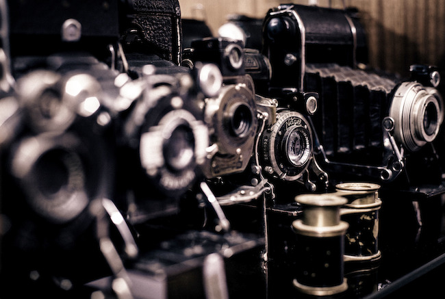 Close-up images of old school cameras