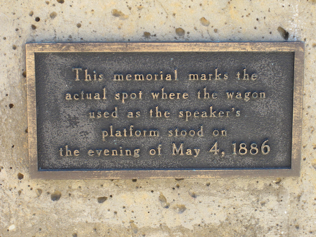 This plaque appears on the memorial statue erected where Samuel Fielden was speaking when the riot broke out.