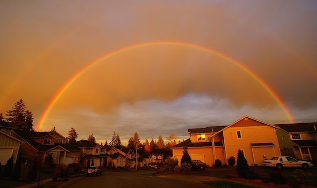 rainbow over a neighborhood of houses